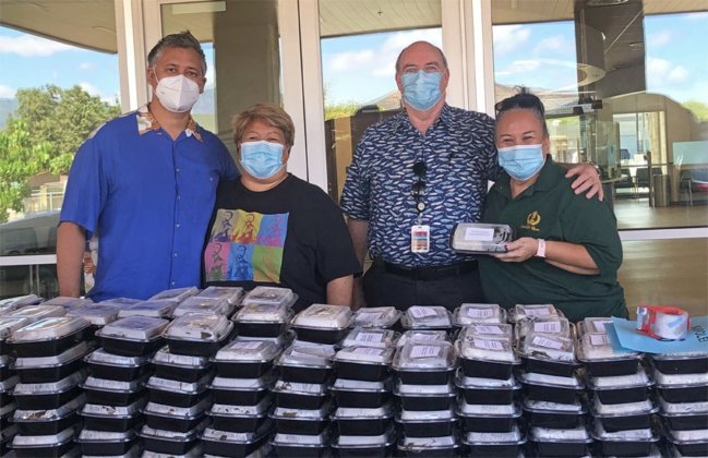 Photo: Brendon Kalei’āina Lee, and Lunalilo Home’s Dietary Manager Tammy Smith and HR Director Hauoli Keawe-Aiko