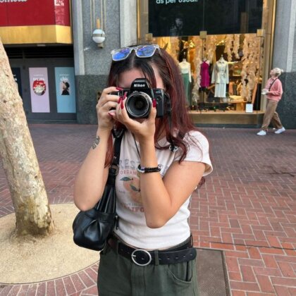 Photo: Mele with an SLR camera