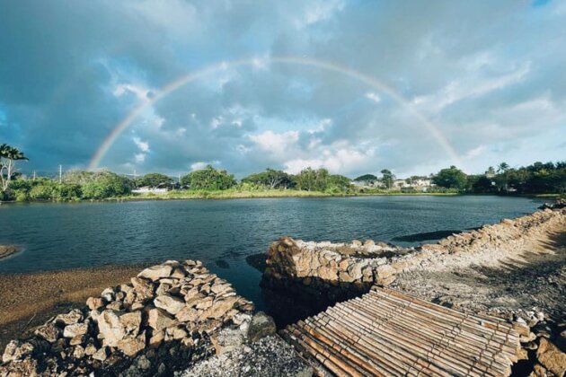 Photo: Rainbow over loko iʻa Pāʻaiau