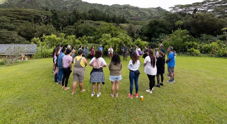 Photo: Puni Jackson welcomes the community into an aloha circle