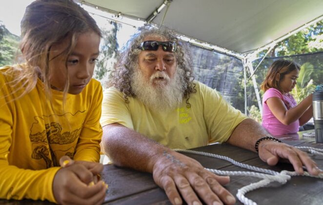Photo: Uncle Scotty Garlough passes down the skill of tying knots