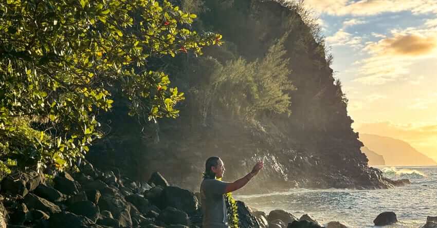 Photo: Kumu Hula Devin Kamealoha Forrest conducts hula protocol at Kēʻē Beach