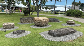 Photo: Latte stones from Guåhan and Rota on display in front of Hawaiian Hall