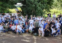News Briefs | October 2025 Office of Hawaiian Affairs (OHA) staff pose or a photo at a service learning activity at the wahi kapu of Kūkaniloko
