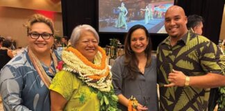 News Briefs | November 2025 Photo: Mele Apana, honoree Tammy Smith poses for a photo with OHA staff and trustees