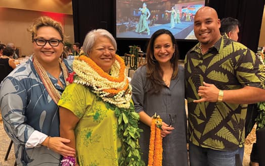 Photo: Mele Apana, honoree Tammy Smith poses for a photo with OHA staff and trustees