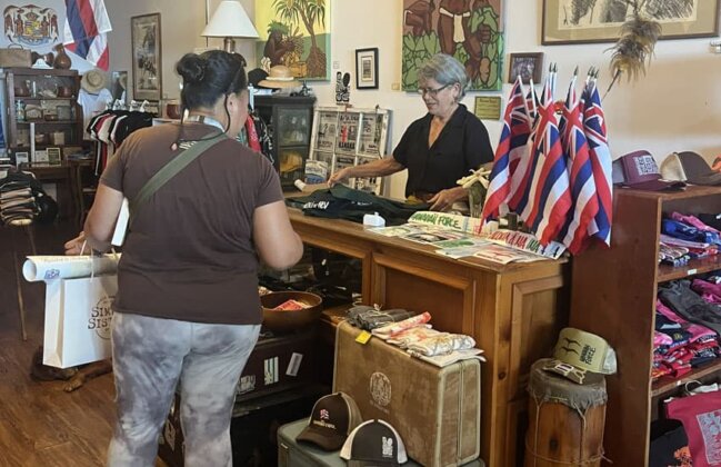 Photo: Luana Neff helping a customer