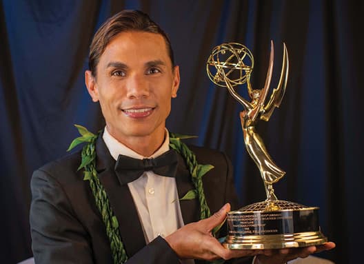 Photo: Keoni Alvarez holding his Emmy award