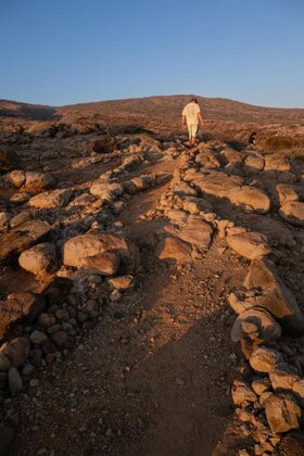 Photo: A lone hiker walks the Ala Loa Trail.