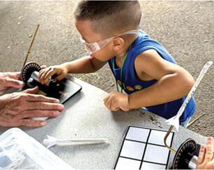 Photo: Keiki of all ages learned to build and launch paper rockets