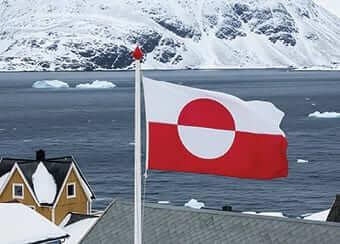Greenland Photo: Greenland flag flies over a home