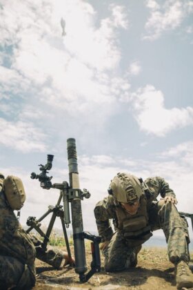 Photo: Soldier firing a mortar during training exercises