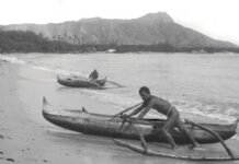 The Moʻolelo of Waikīkī Photo: A man pushes a canoe from the water at Waikīkī in the late 1880s