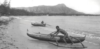 The Moʻolelo of Waikīkī Photo: A man pushes a canoe from the water at Waikīkī in the late 1880s