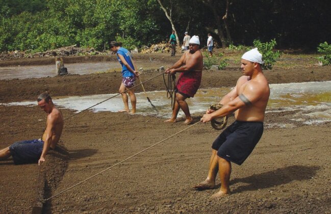 Photo: Volunteers work to restore water to a Loi